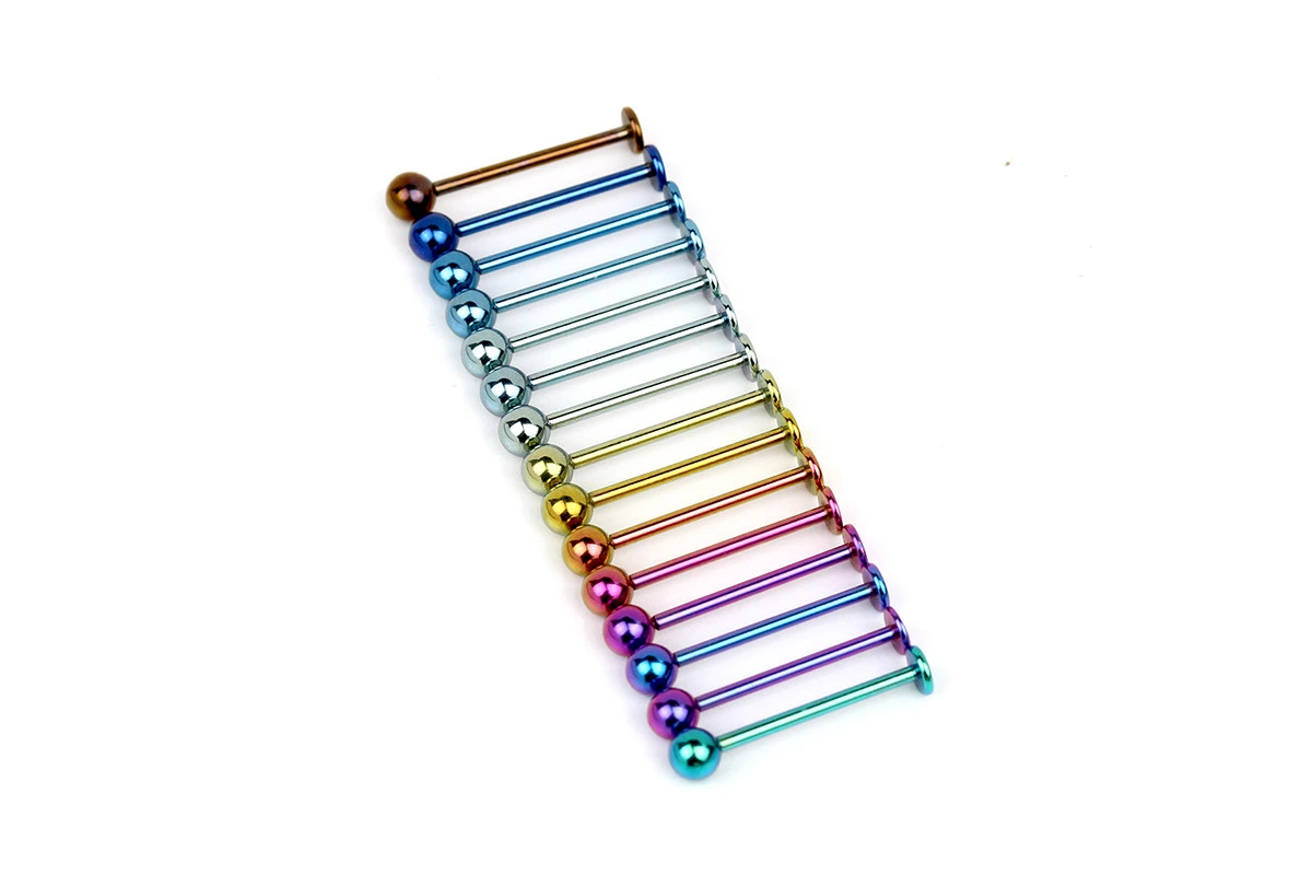 Anodized titanium stud earrings in rainbow colors showing implant-grade barbell studs